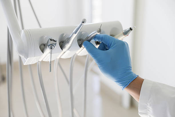 Professional Tooth Extraction technician working in Booneville, MS